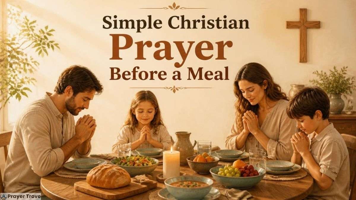 Family praying before a meal with a cross on the wall