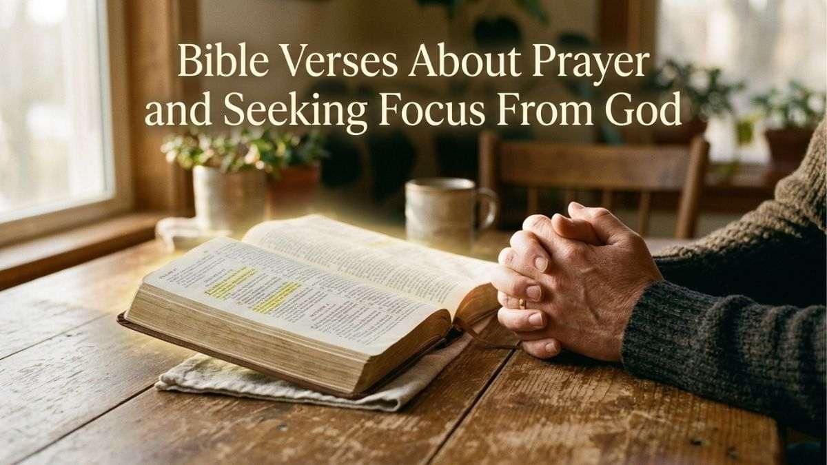 Bible and praying hands on table